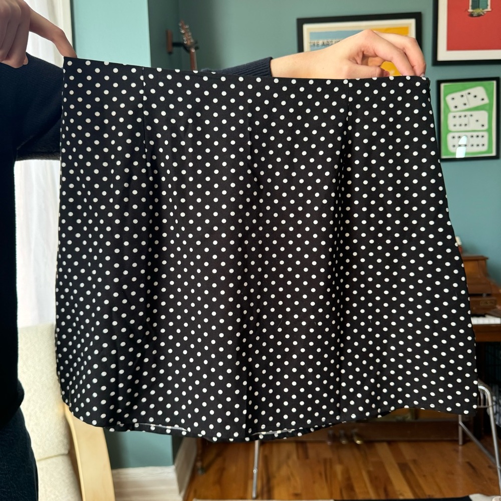 Black polka dot mini skirt